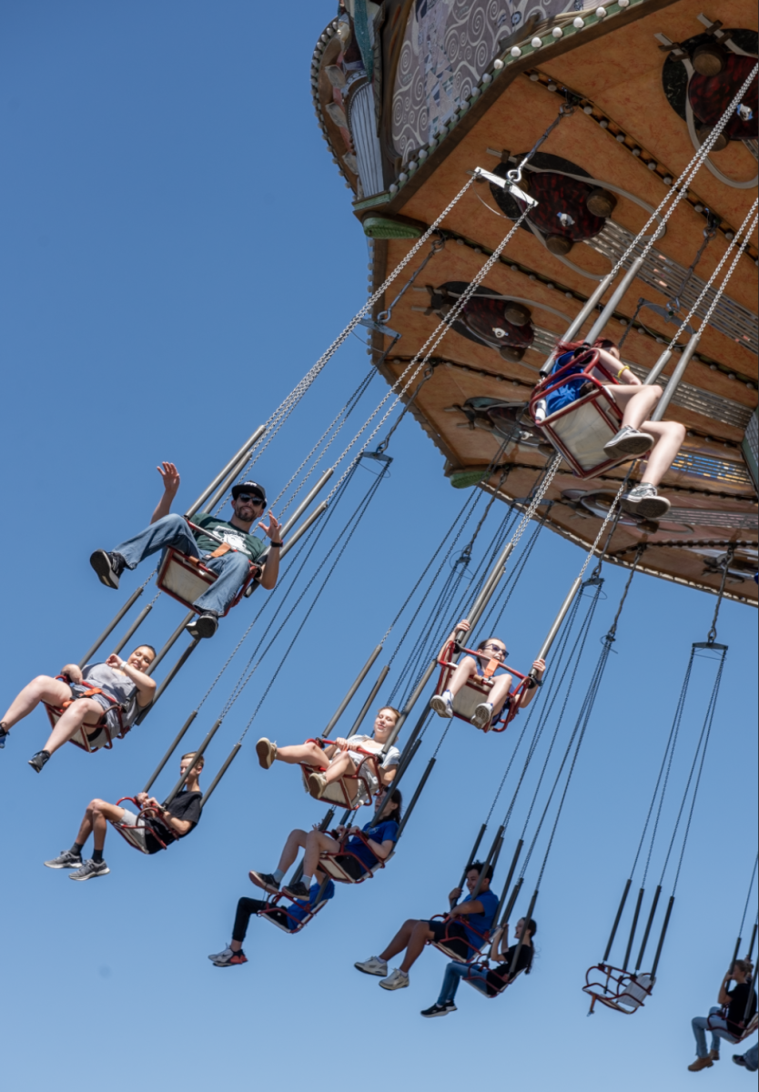 5.10.25 Band director Mr. Martinez and his daughter on the “Turn of the Century” ride at Elitch Gardens. 